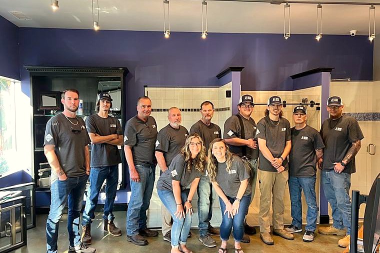 The Brinn Glass residential team in the New Bern showroom